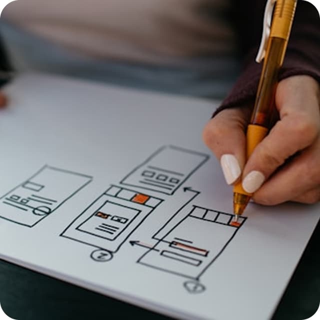 UX designer sketching wireframes for a product interface